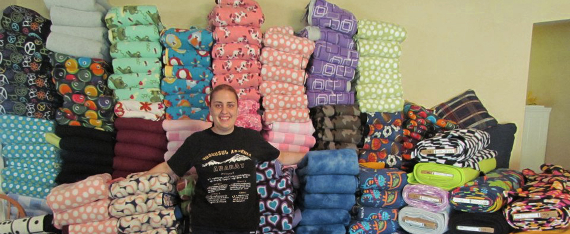 Kristina Garabedian '08 is the founder of Shoebox Sharing — a nonprofit that donates fleece blankets, scarves and school supply packs around the globe.