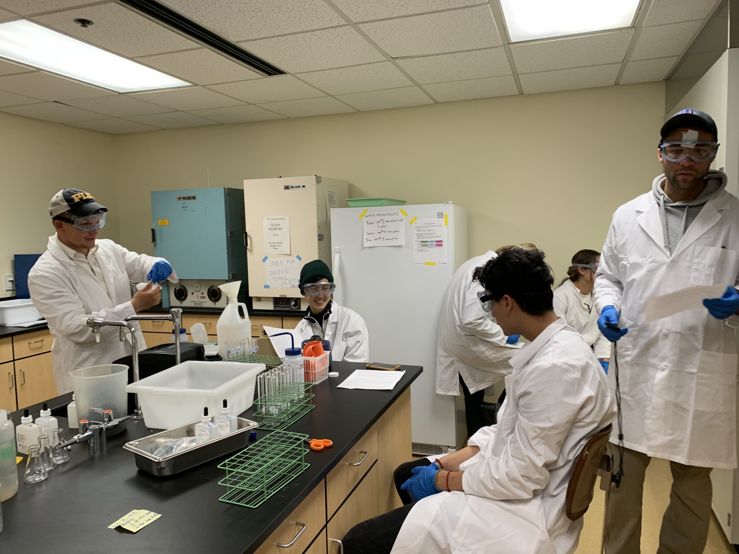 Environmental studies conducting research in a lab.