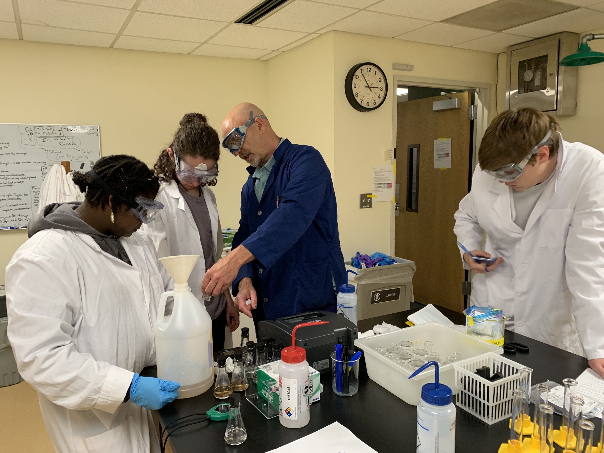 Environmental studies conducting research in a lab.