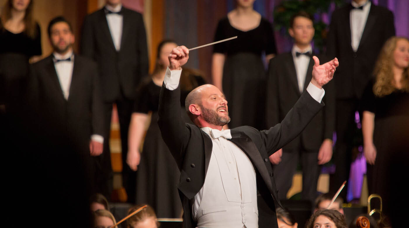 PLU music chair and professor of music Brian Galante conducting at the 2015 Christmas concert.