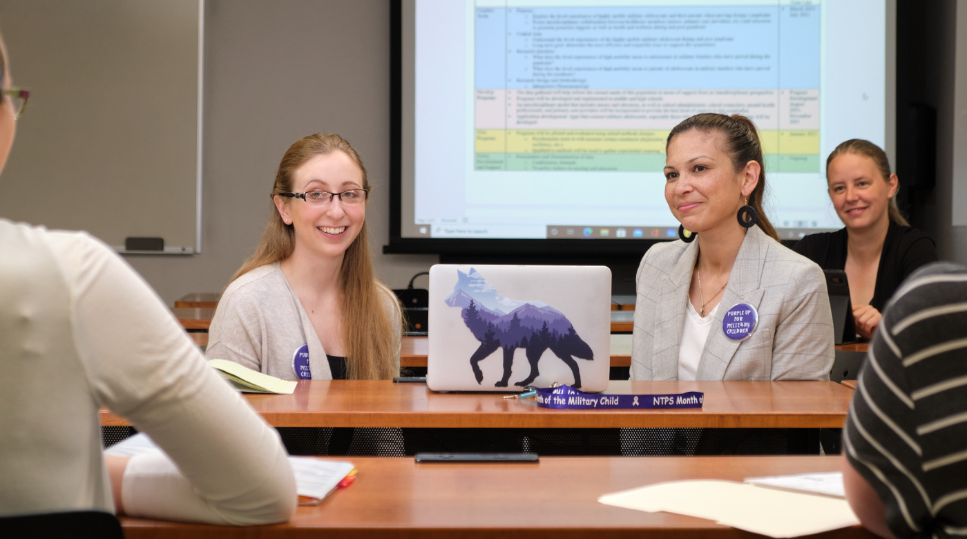 Erica Palmer '21, left, confers with Prof. Jennifer Thomas regarding her project looking at the effects of mobility of children in military families,