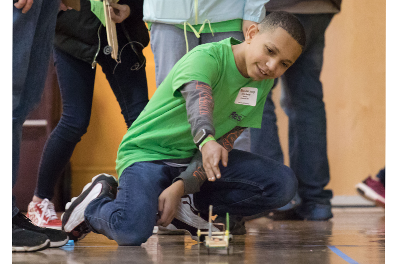 MESA participant watches his robot travel across the floor
