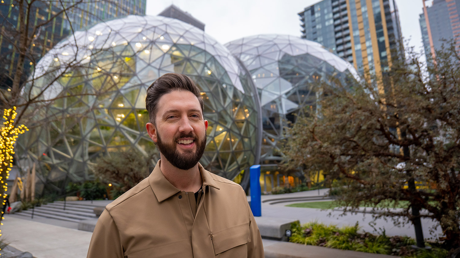 Regan Zeebuyth stands in front of the Amazon Spheres in downtown Seattle