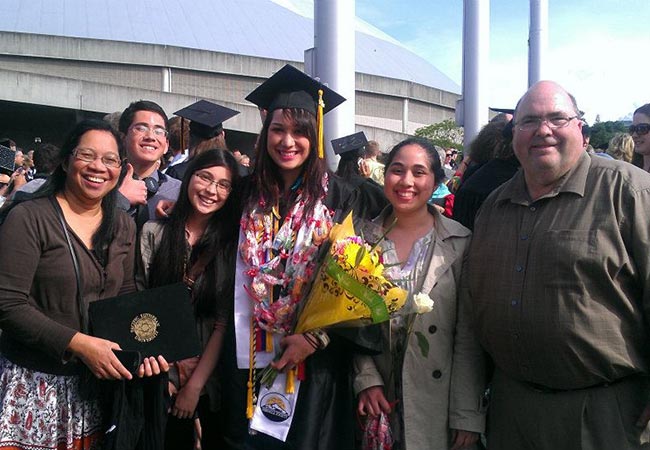 Angela Pierce-Ngo with her parents at PLU Commencement in 2012