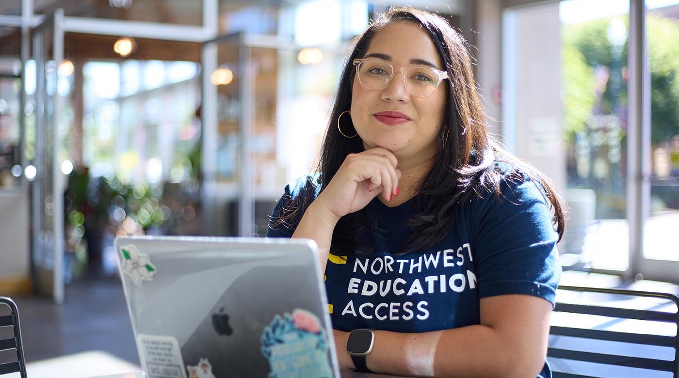 Angela Pierce-Ngo ’12, a director with Northwest Education Access, photographed in a Pierce Country Library, a typical spot to meet clients along with coffee shops, Monday, Aug. 15, 2022, in University Place. (Photo/John Froschauer)