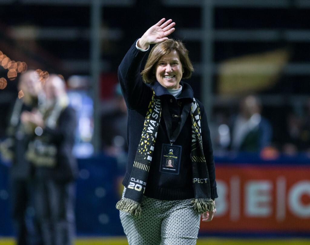 Colleen Hacker waves to the crowd while being honored on the field at a Tacoma Stars soccer game.
