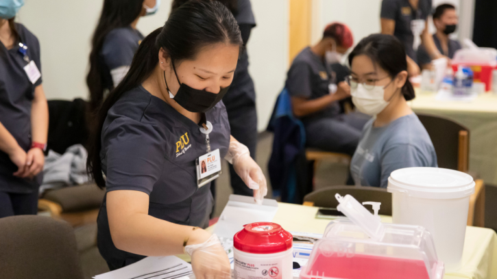 PLU MSN students running their annual flu shot clinic in fall 2022.