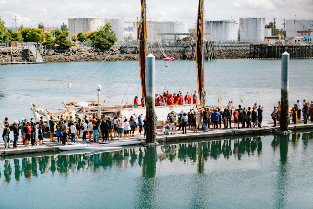 Local community members gather on the dock outside thea foss waterway to welcome as crew of the Hōkūle‘a tie to the dock.