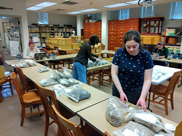 PLU students work on prepparing Woodard Bay materials to deliver them to the Nisqually Tribe
