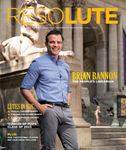 Cover of the 2023 issue of Resolute magazine. Librarian Brian Bannon stands in front of the HQ of the New York Public Library. Above him the image says "RESOLUTE" in PLU's signature gold.