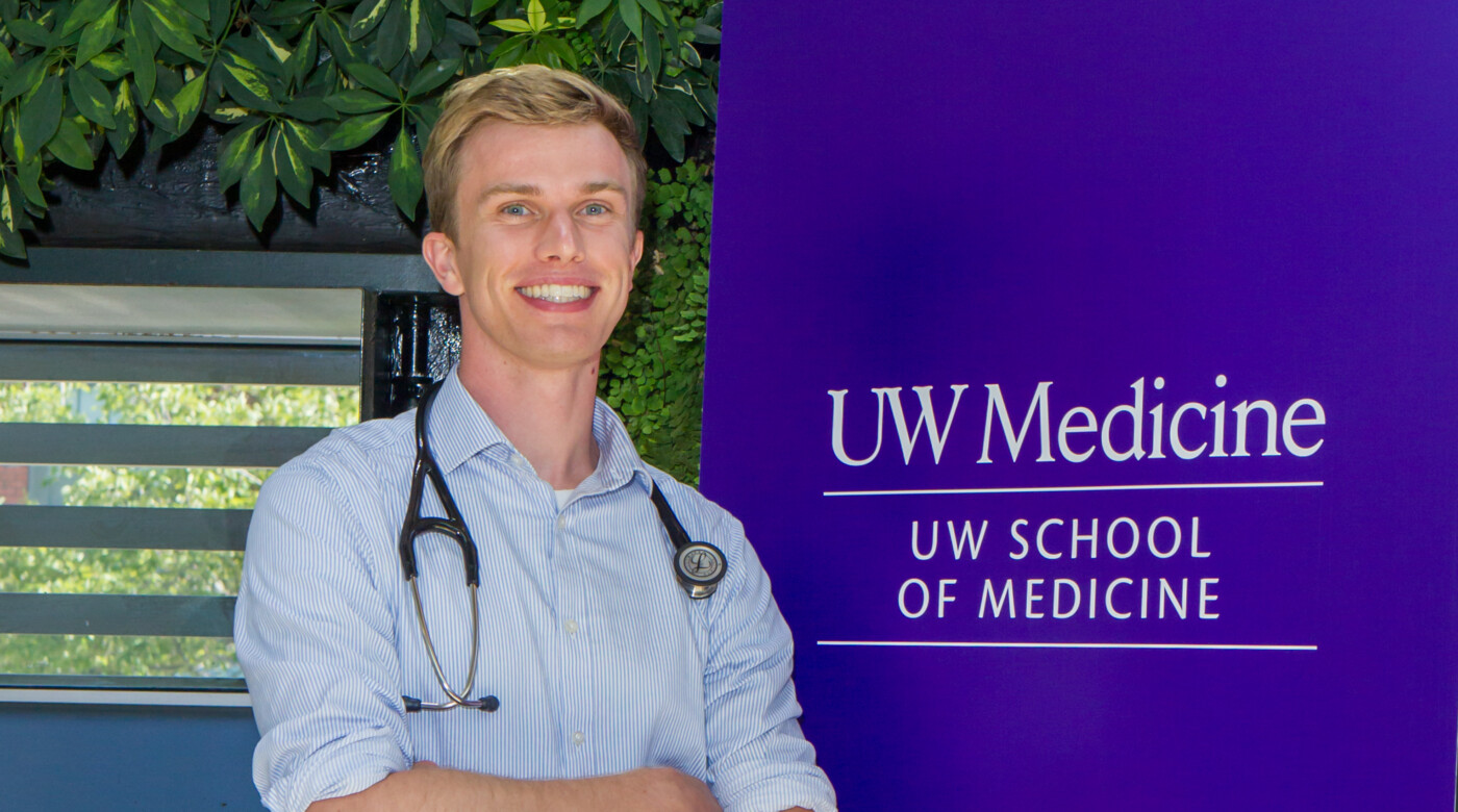 Banken posing in front of the UW School of Medicine Sign. All photos in this article are provided by Banken.