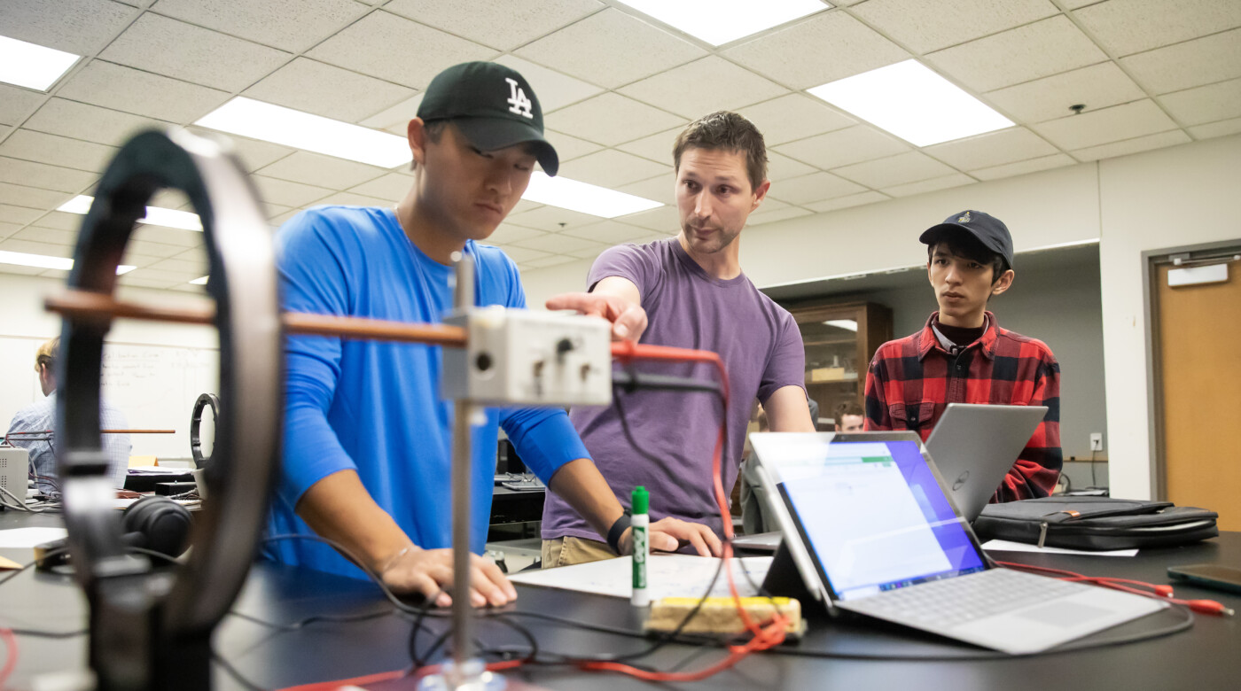Students in Physics Chair Bret Underwood’s PHYS 310 course titled” Methods of Experimental Physics” experiment with big coils of wire and magnetic fields, Thursday, Oct. 5, 2023, in the Rieke Science Center at PLU. (PLU Photo / Sy Bean)