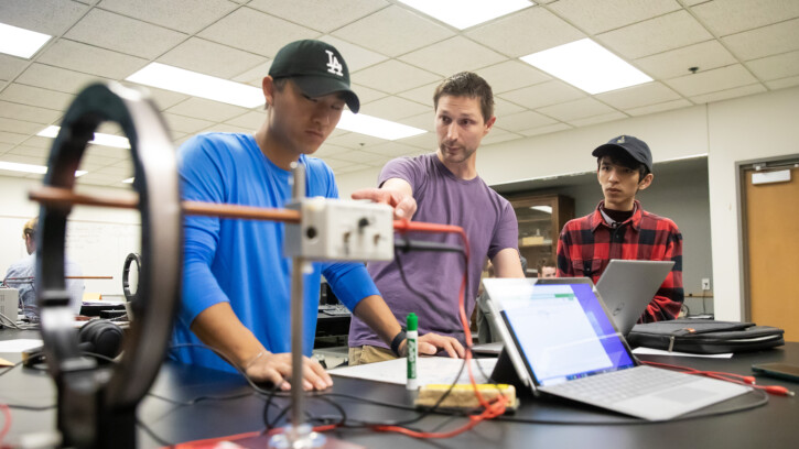 Students in Physics Chair Bret Underwood’s PHYS 310 course titled” Methods of Experimental Physics” experiment with big coils of wire and magnetic fields, Thursday, Oct. 5, 2023, in the Rieke Science Center at PLU. (PLU Photo / Sy Bean)