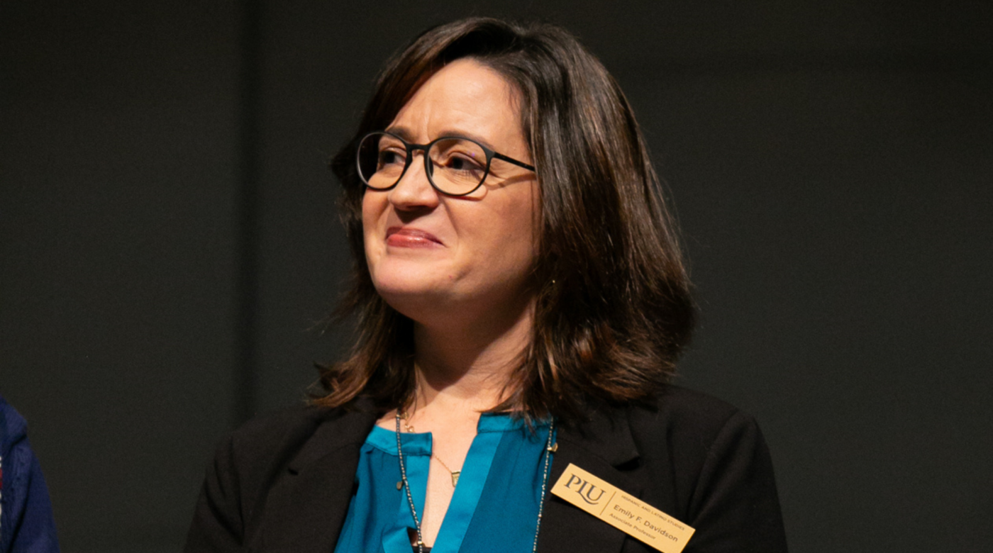 Emily Davidson smiles as she receives the 2023 Faculty Excellence Award in Teaching.