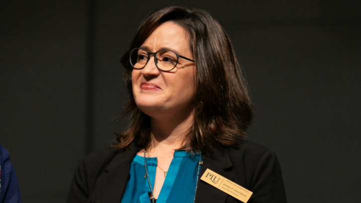 Emily Davidson smiles as she receives the 2023 Faculty Excellence Award in Teaching.