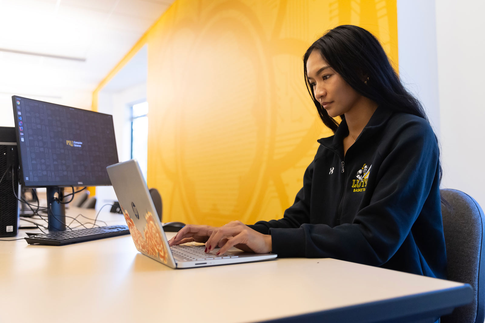 Computer Science major and student-athlete Ashley Akamine works on her senior capstone, Wednesday, Oct. 16, 2024, at PLU. (PLU Photo / Sy Bean) Computer Science major and student-athlete Ashley Akamine works on her senior capstone, Wednesday, Oct. 16, 2024, at PLU. (PLU Photo / Sy Bean)