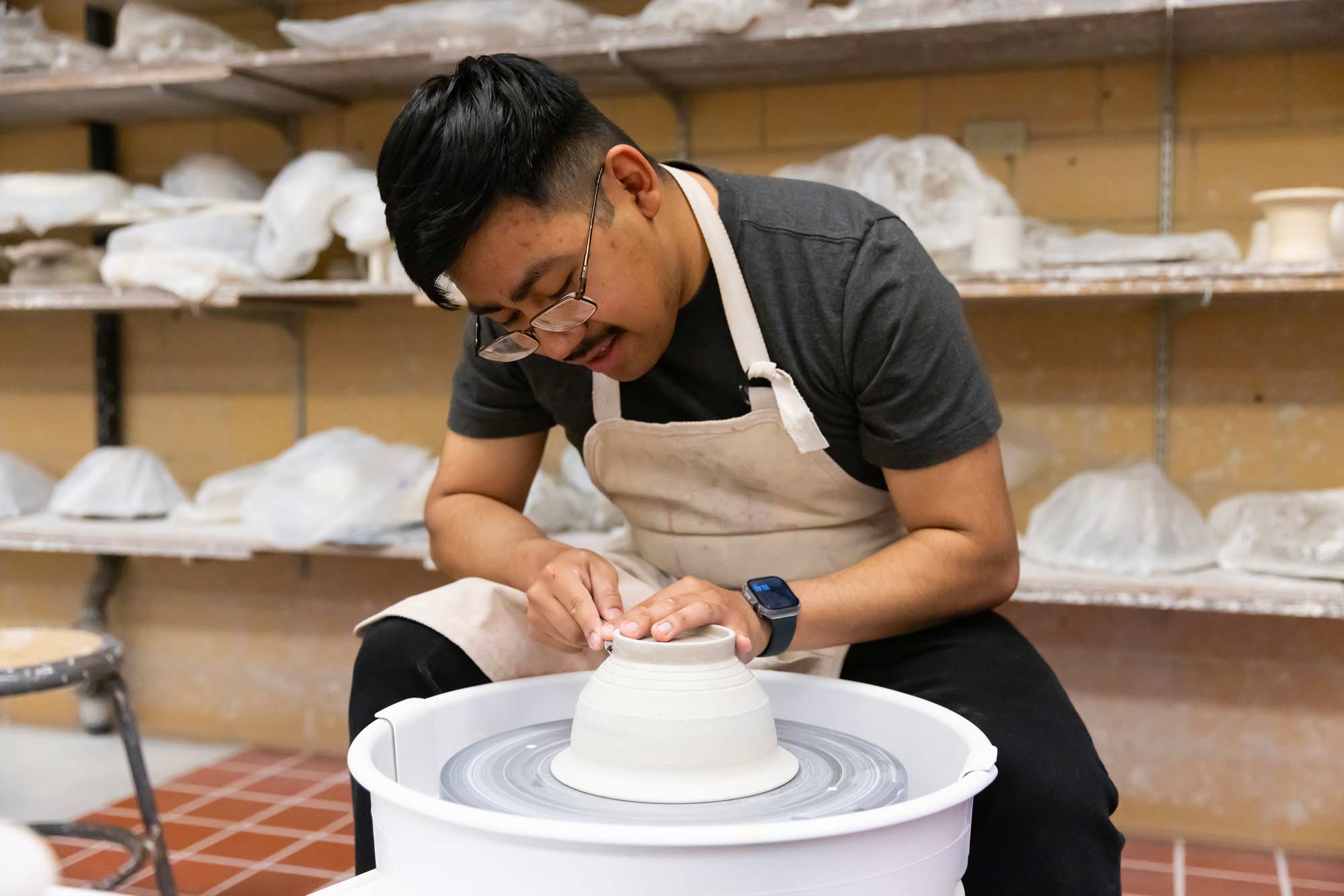 Senior graphic design major Guillermo Baltazar-Munoz works in the ceramics studio, Thursday, April 24, 2025 Senior graphic design major Guillermo Baltazar-Munoz works in the ceramics studio, Thursday, April 24, 2025