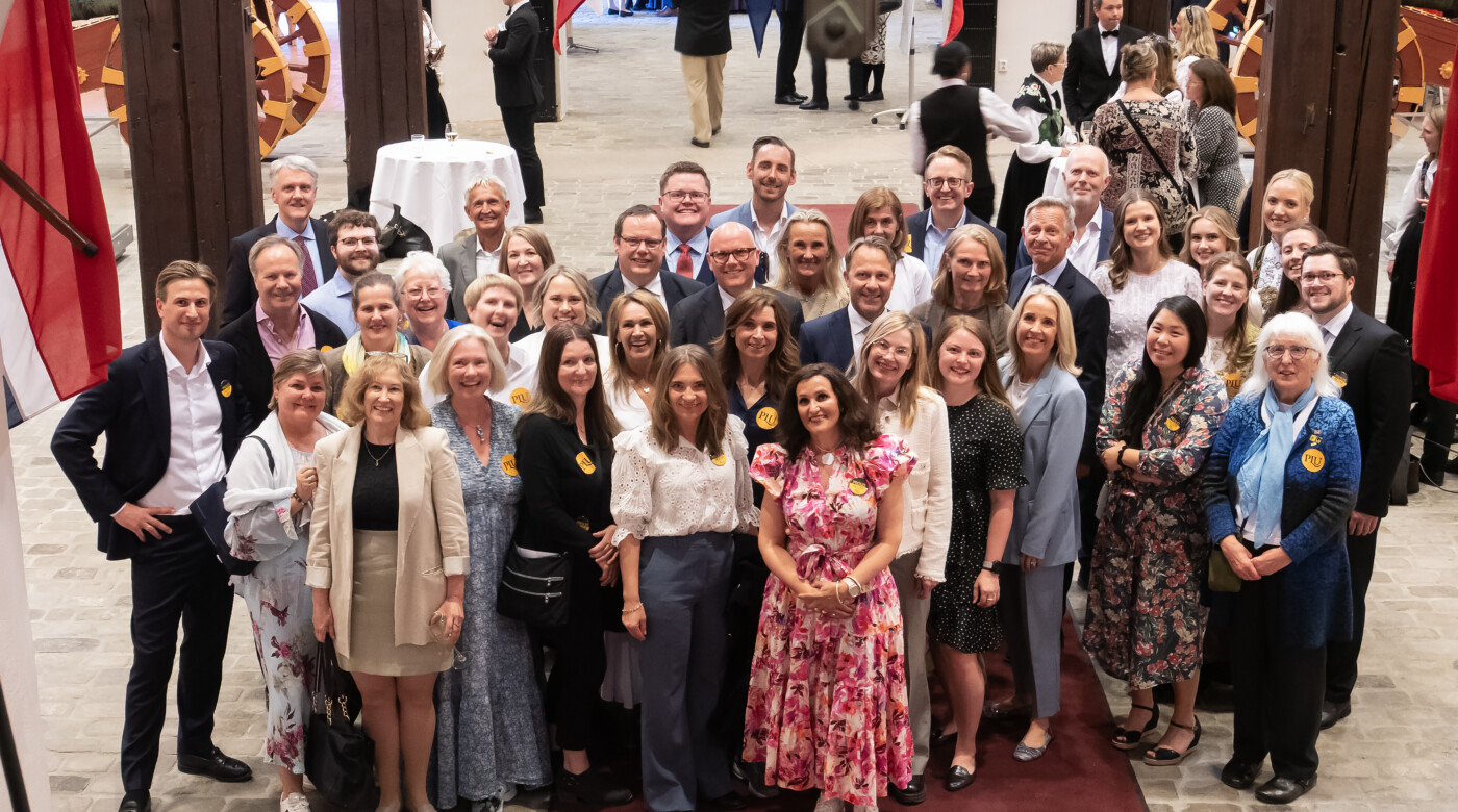 A group of PLU alumni in Norway pose for a group photo.