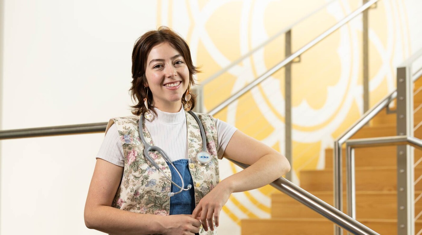 Olivia Tate, graduating with degrees in Nursing, Religion, an individualized major in Native American and Indigenous studies with a minor in Peace Car Prep Certification, poses for their Senior Spotlight portrait, Tuesday, May 20, 2025, in the at PLU School of Nursing Clinical Learning and Simulation Center. (PLU Photo / Sy Bean)