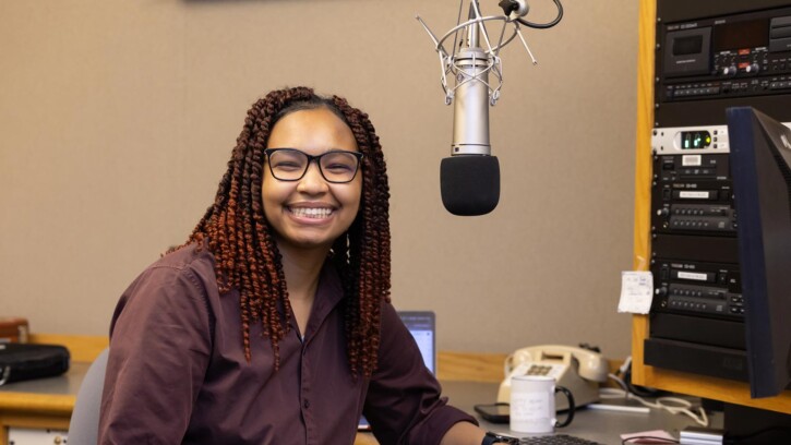Zari Warden, a double major in Communication and Gender, Sexuality, and Race Studies, works in the student ran Lute Air Student Radio (LASR), Tuesday, April 29, 2025, in the Neeb Building at PLU. (PLU Photo / Sy Bean)
