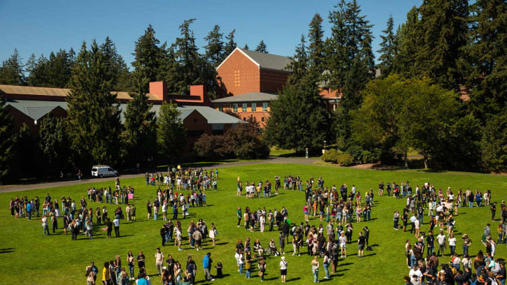 New PLU students gather on Foss Field.