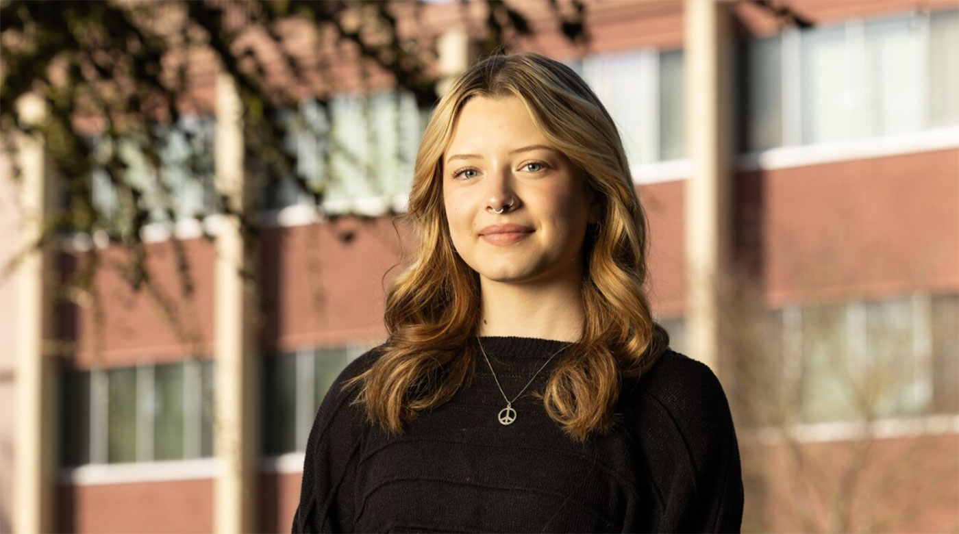 Gracie Hansen '25 standing and smiling