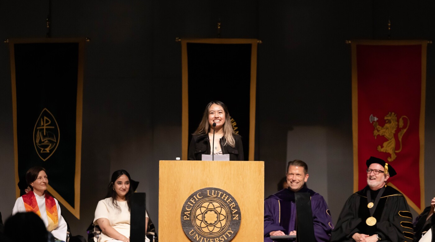 Morales smiles at a podium during her speech for the incoming class of 2029 at Convocation.