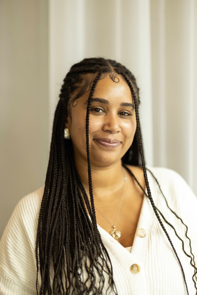 20251017_SB_Bloom-Again-Therapy_011-full Alum Kiara Holden smiles for a portrait.