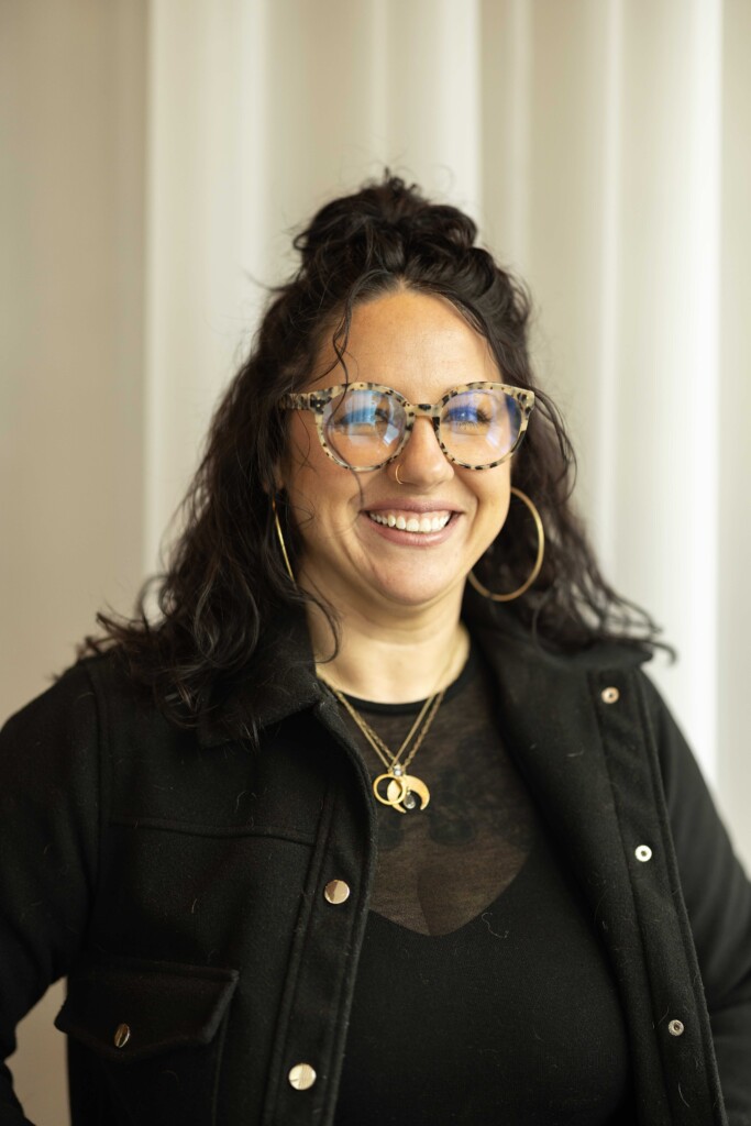 20251017_SB_Bloom-Again-Therapy_013-full Alum Megan Irving smiles for a portrait.