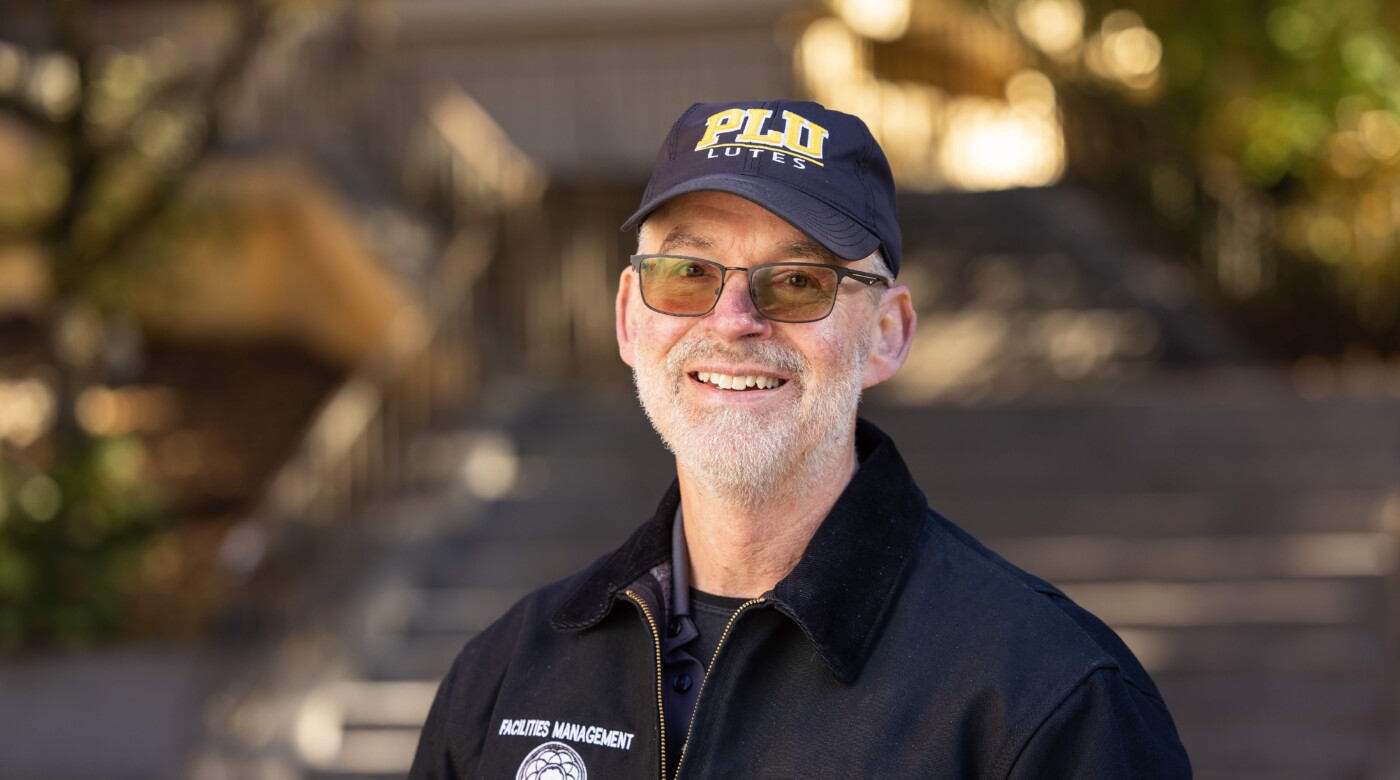 Associate Vice President of Facilities, Greg Perkinson, smiles at the camera.