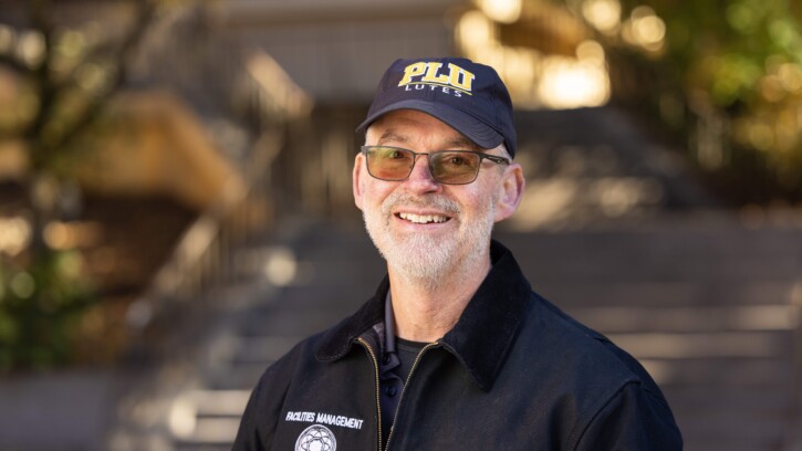 Associate Vice President of Facilities, Greg Perkinson, smiles at the camera.