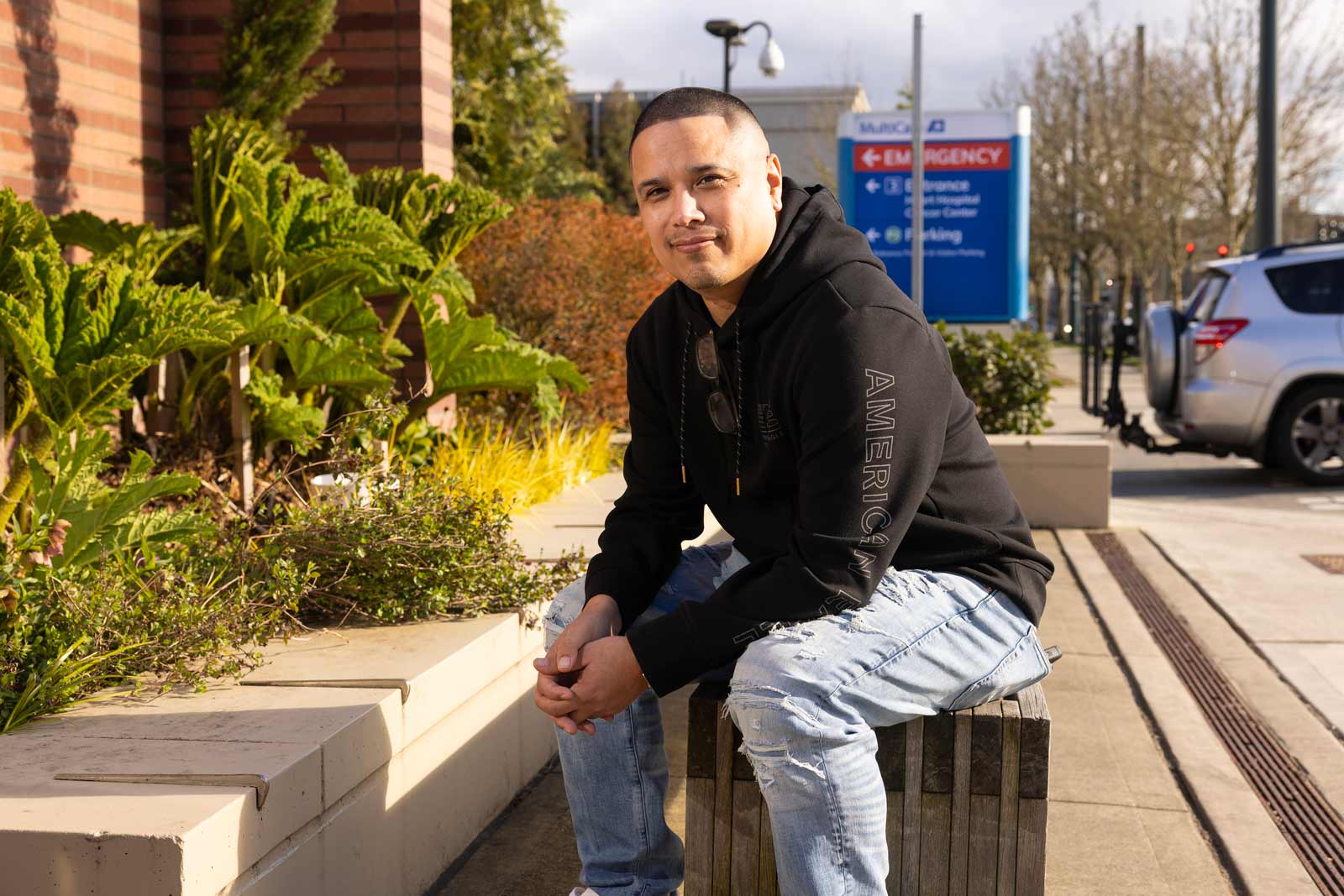 BSW student Eric Camel poses outside of Mary Bridge Children’s Hospital where he is currently placed as part of his major, Thursday, April 2, 2026, at PLU. (PLU Photo / Sy Bean)