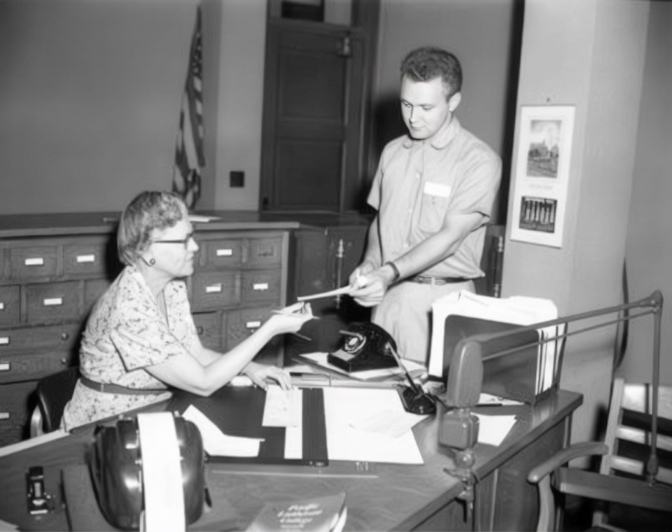 Ed Larson and Eleanor Peterson in the Business Office 1956-1957