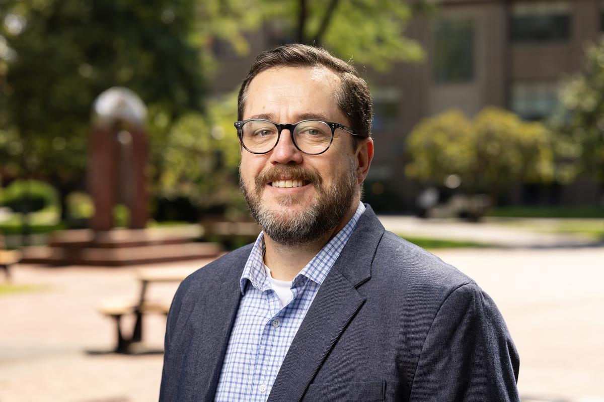 John Wright, Associate Dean and Assistant Professor of Education, poses for their new portrait, Monday, Aug. 25, 2025, at PLU. (PLU Photo / Sy Bean)