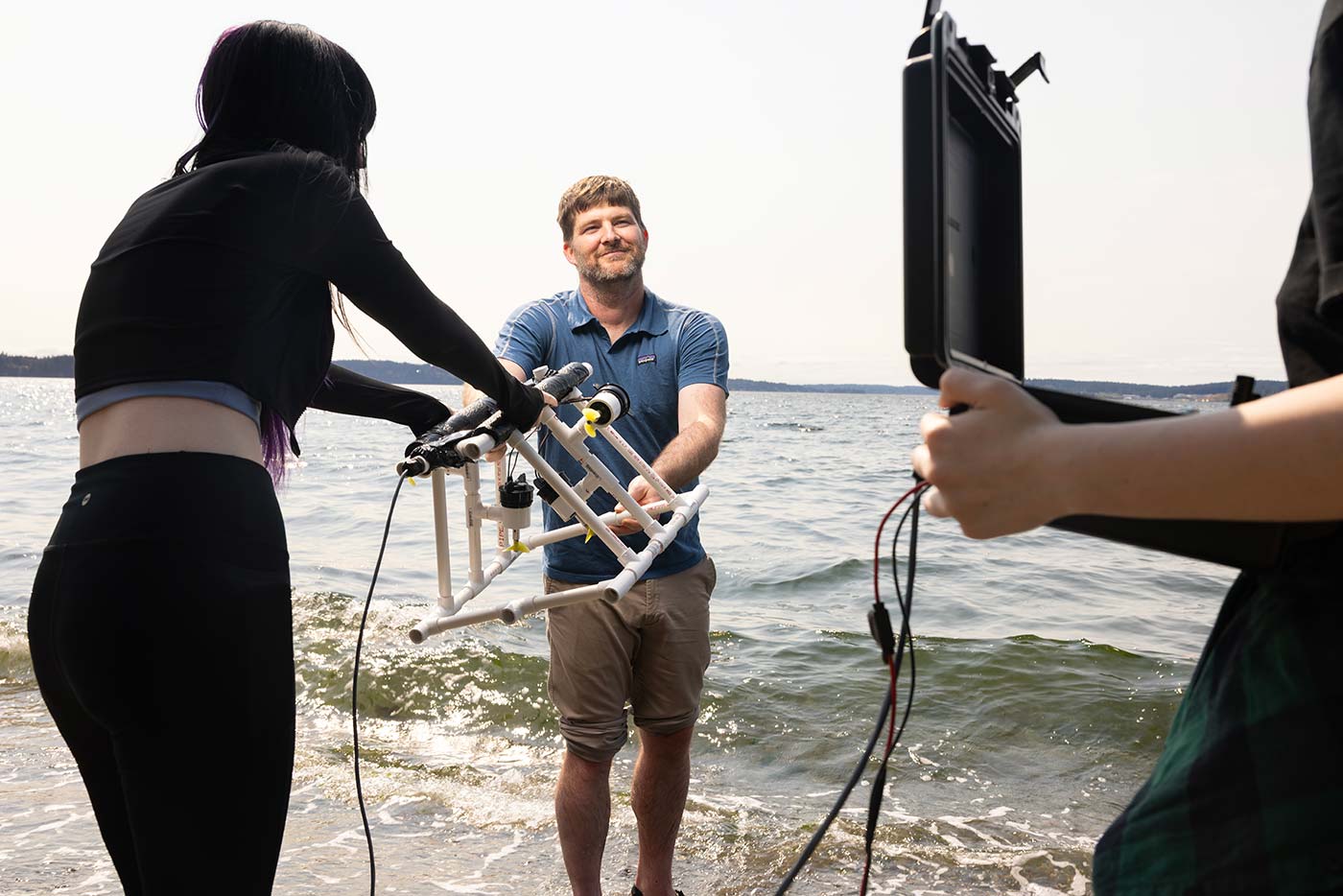 Associate Professor of Computer Science Jeff Caley and his research students, Thursday, July 23, 2026, at Sunnyside Beach Park. Photographed for Resolute. (PLU Photo / Sy Bean) Associate Professor of Computer Science Jeff Caley and his research students, Thursday, July 23, 2026, at Sunnyside Beach Park. Photographed for Resolute. (PLU Photo / Sy Bean)