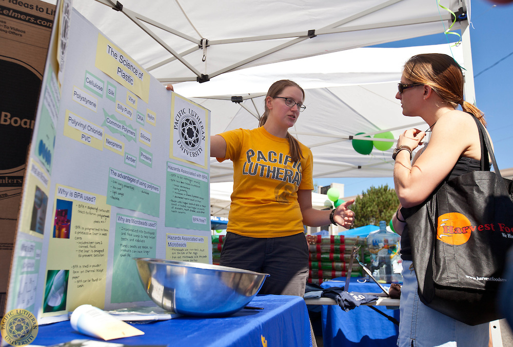 PLU Chemistry Club with an educational tent set up at the Proctor Market in Tacoma on Saturday, Sept. 6, 2014. (Photo/John Froschauer)