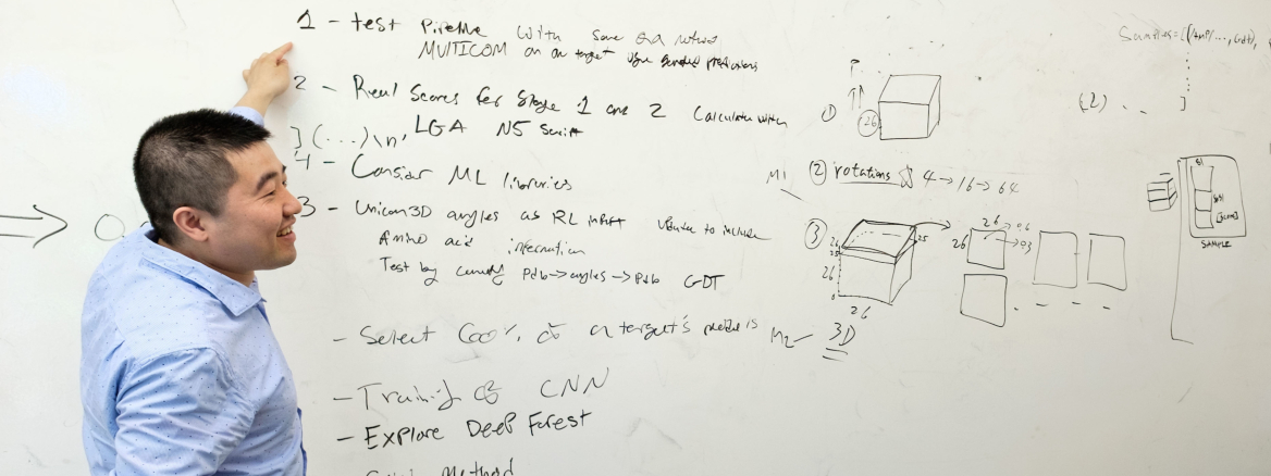 renzhi_web crop Renzhi in front of whiteboard
