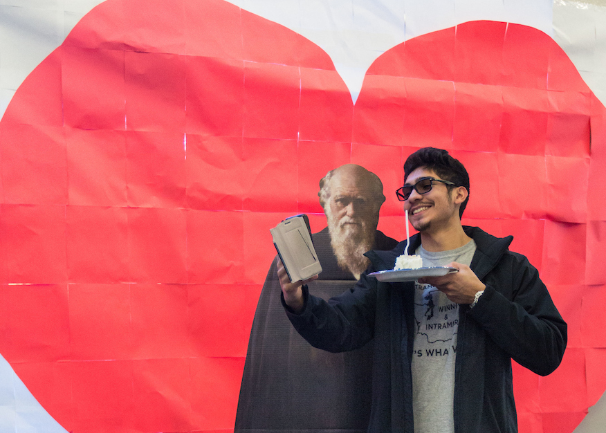 Student posing with Charles Darwin.