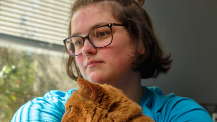 Image: Paige Balut attending code writing class online with her cat Goldie, Monday, March 16, 2020, at PLU. (Photo/John Froschauer)