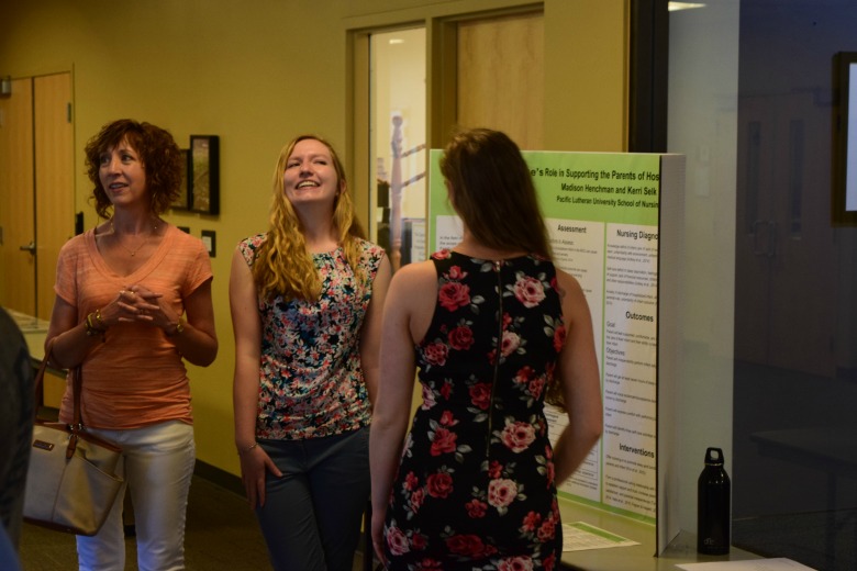 Capstone Poster Presentations for Spring 2016 (Photo: Kate Prigge, SoN) students talking to others about their research