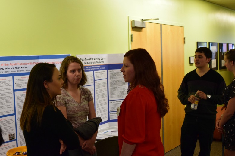 Capstone Poster Presentations for Spring 2016 (Photo: Kate Prigge, SoN) students talking to others about their research