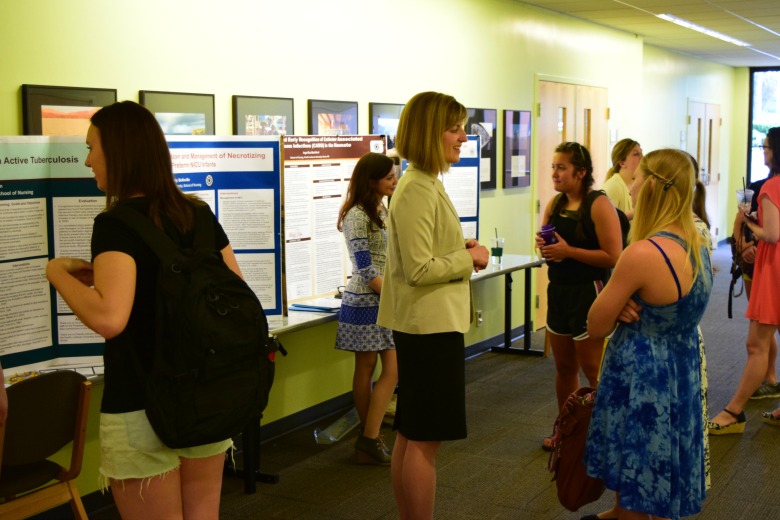 Capstone Poster Presentations for Spring 2016 (Photo: Kate Prigge, SoN) students talking to others about their research