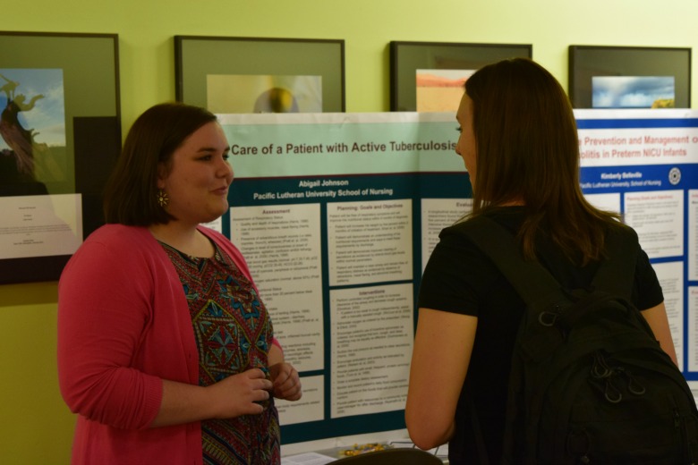 Capstone Poster Presentations for Spring 2016 (Photo: Kate Prigge, SoN) students talking to others about their research