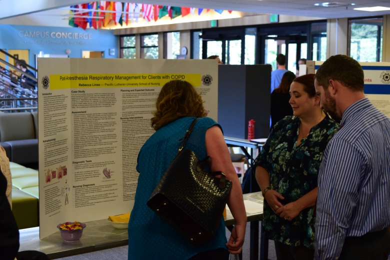 Capstone Poster Presentations for Spring 2016 (Photo: Kate Prigge, SoN) students talking to others about their research
