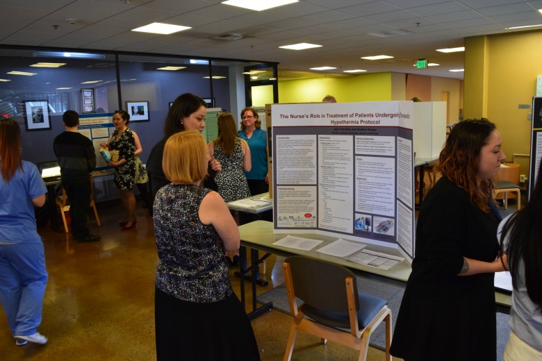 Capstone Poster Presentations for Spring 2016 (Photo: Kate Prigge, SoN) students talking to others about their research