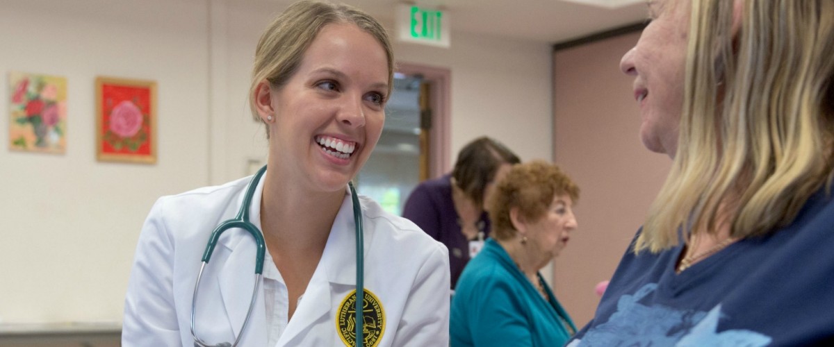 A PLU Nurse Practitioner student works during a health-outreach activity at the Sumner Senior Center. (Photo: John Froschauer/PLU)