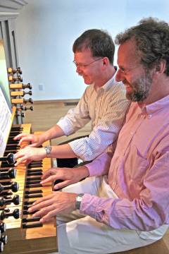 Dr. Tegels and Dana Robinson playing the organ
