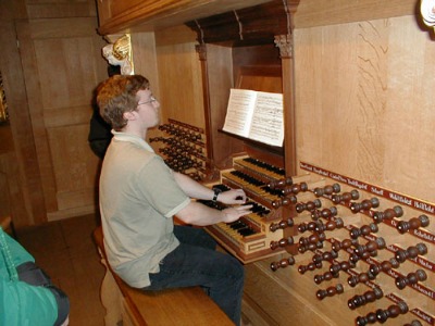 plu-student-1 PLU Student playing an organ