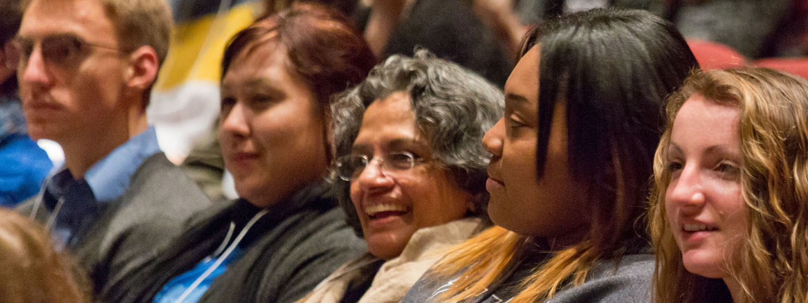 Audience members listening intently