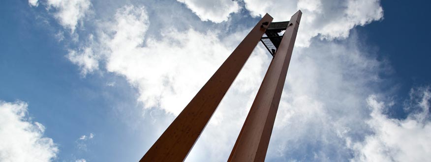 Looking up at the Clock tower on a partly cloudy day